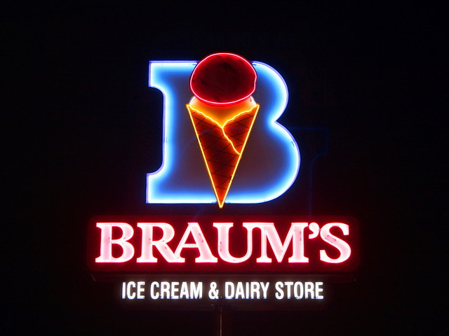 Neon "Braum's Ice Cream" sign. The letters B R A U M and S are lit up