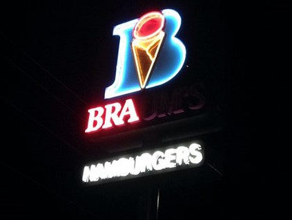 Neon "Braum's Ice Cream" sign. The letters B R and A are lit up